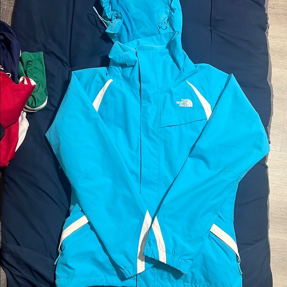 The North Face Turquoise Jacket with White Accents
